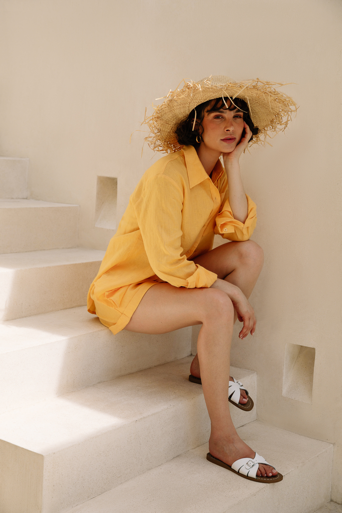 Model wearing a lemon linen shirt and shorts set from Summery The Label, perfect for warm tropical days in Singapore