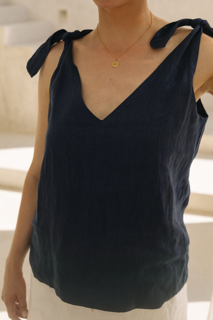 Navy shoulder-tie linen top by Summery The Label, designed for breezy comfort and minimal elegance